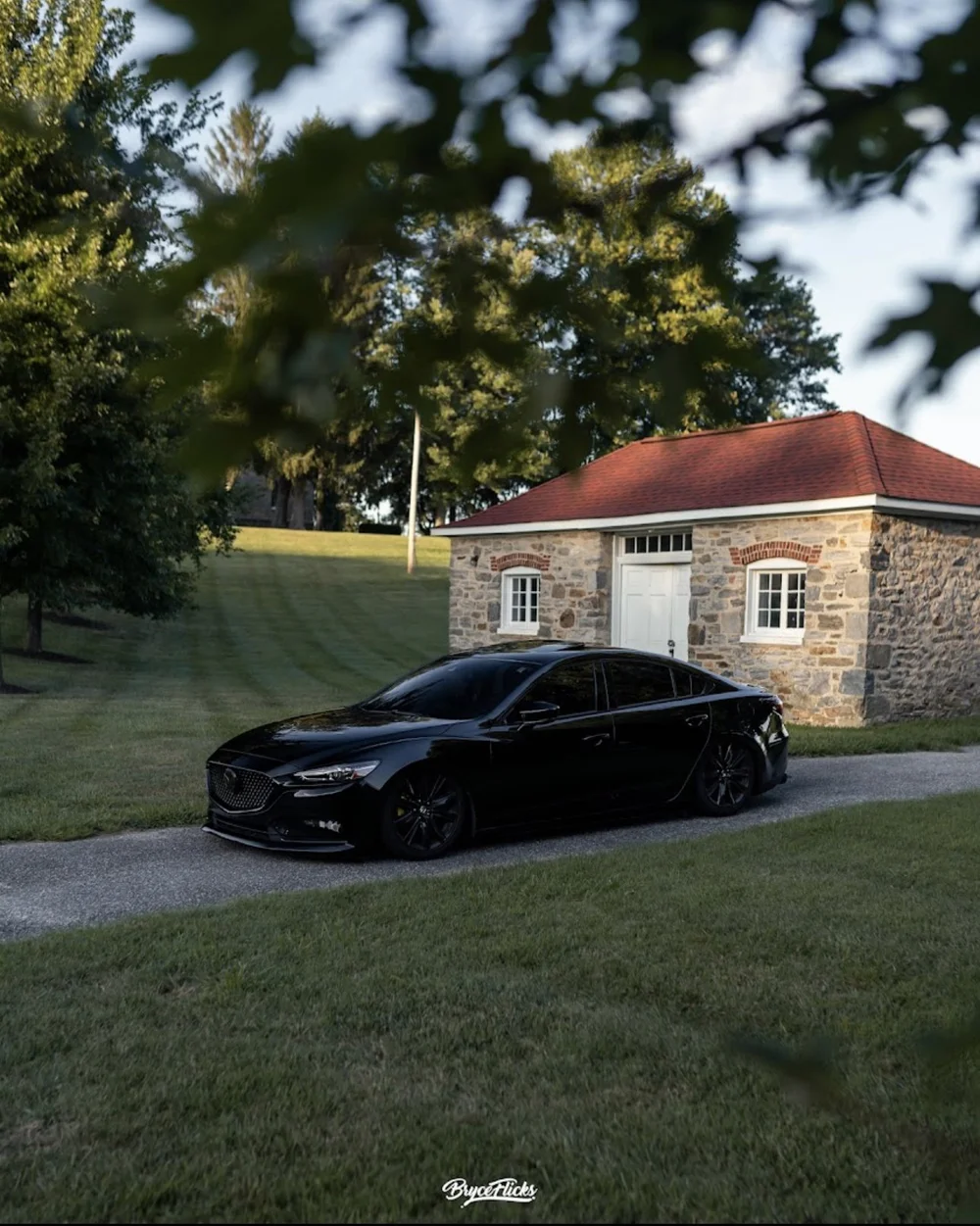 Blacked-out Mazda 6 with dark window tint